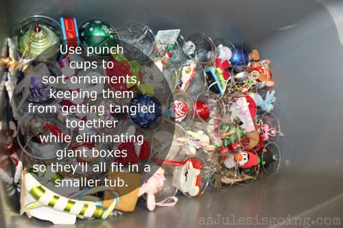 Use punch cups to sort ornaments, keeping them from getting tangled together while eliminating giant boxes so they'll all fit in a smaller tub.